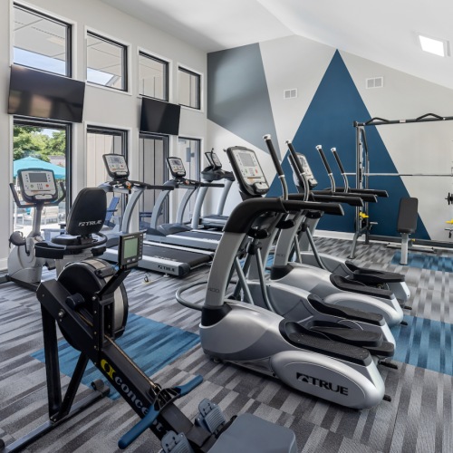 Fitness Center Large fitness center with ample equipment at Lofts at North Hills Apartments in Raleigh, NC