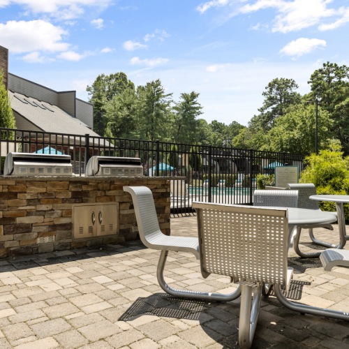 Grill stations with seating  at Lofts at North Hills Apartments in Raleigh, NC 