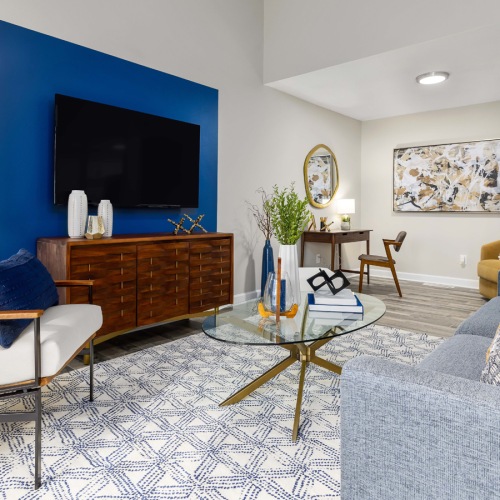 Open space living area with natural lighting Open space living area with natural lighting at Lofts at North Hills Apartments in Raleigh, NC